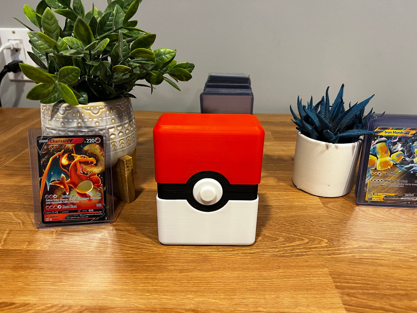 Custom deck box holding sleeved Pokémon TCG cards compatible with standard sleeves