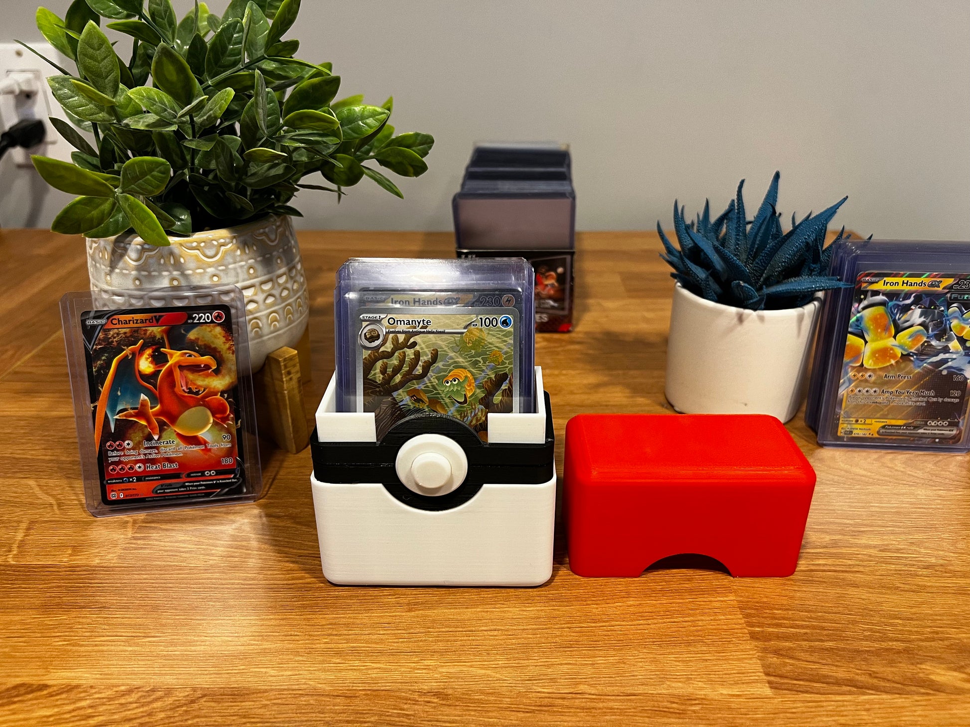 Pokémon card storage box open showing card capacity with snap close lid