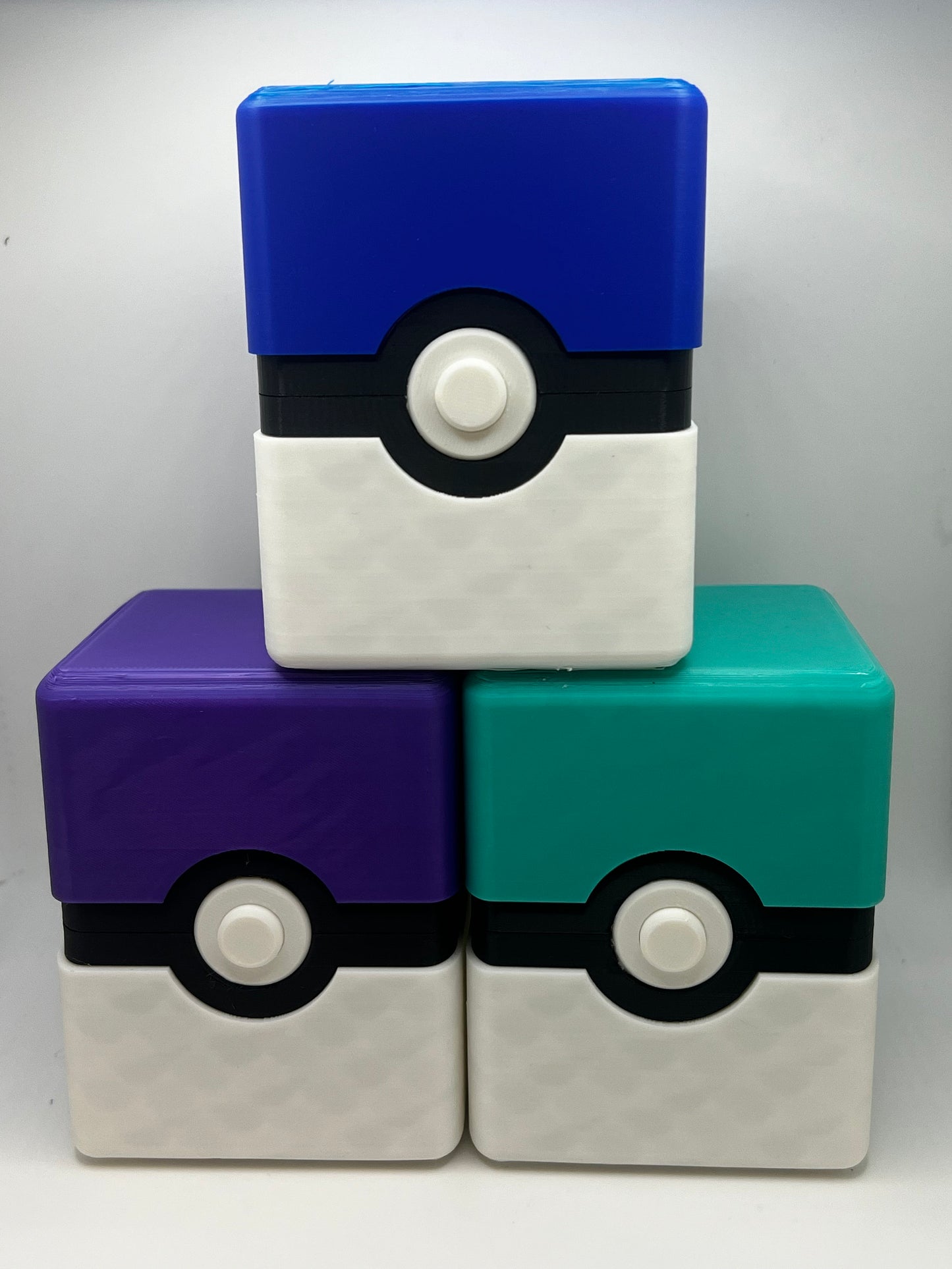 Fan-made Pokémon card box detail showing Pokeball design and secure lid